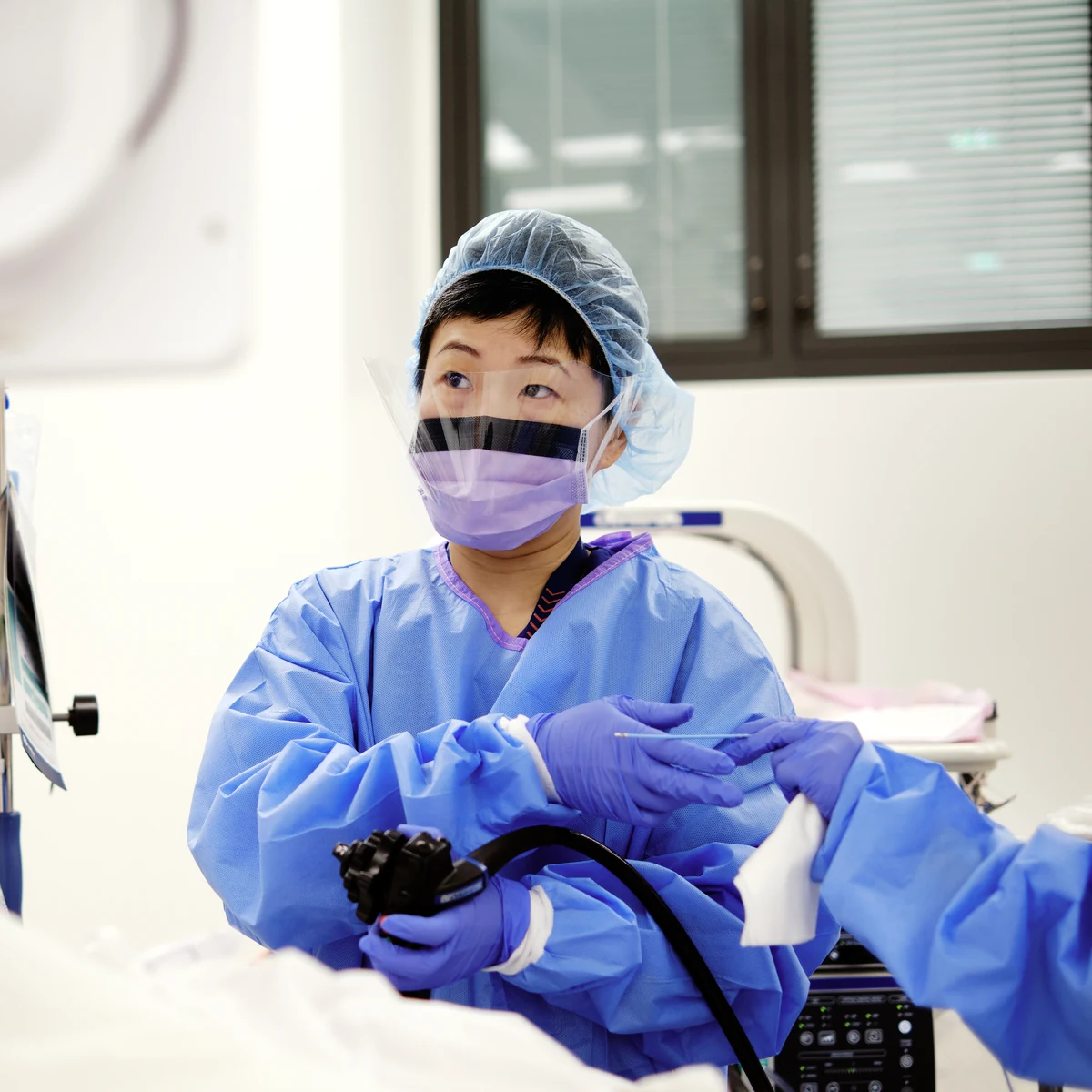 Dr Nicole Winter performing a procedure in an operating theatre
