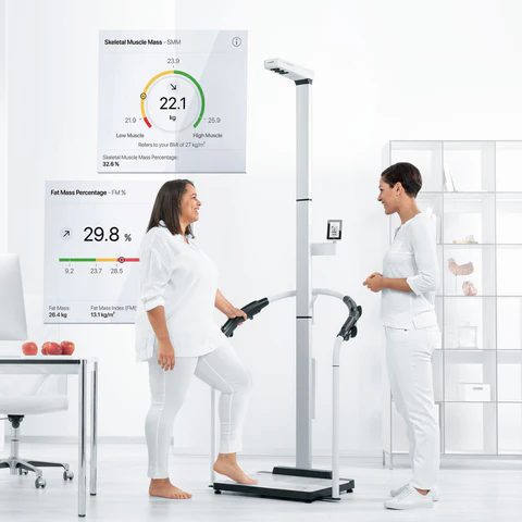 Patient using the seca body composition scanner